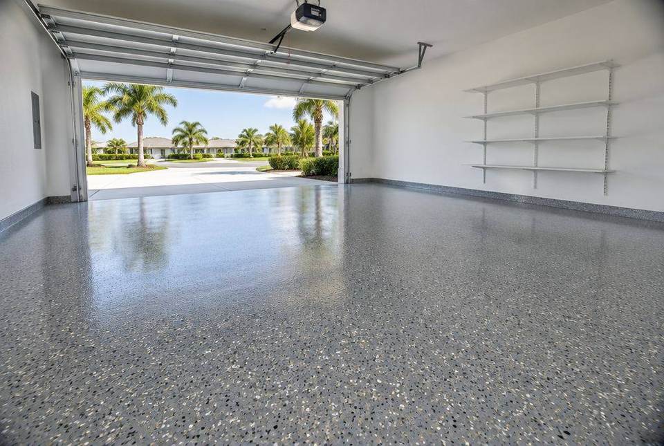 Two-car garage with a gray flake epoxy floor